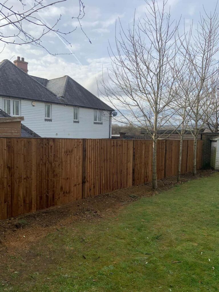 This is a photo of feather edge fencing installed in a residential properties garden by Fast Fix Fencing March