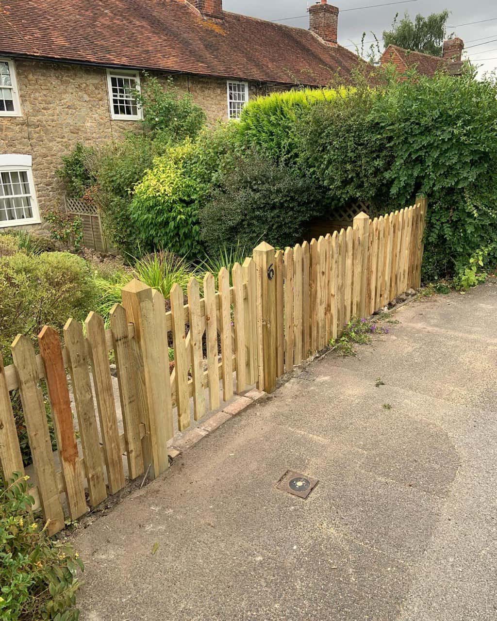 This is a photo of a picket fence and picket gate installed by Fast Fix Fencing March